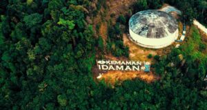 Drone view of picturesque view of hilltop with high green woodland located around stone water tank in Kemaman district in Terengganu Malaysia in Cameron Highlands, Malaysia.